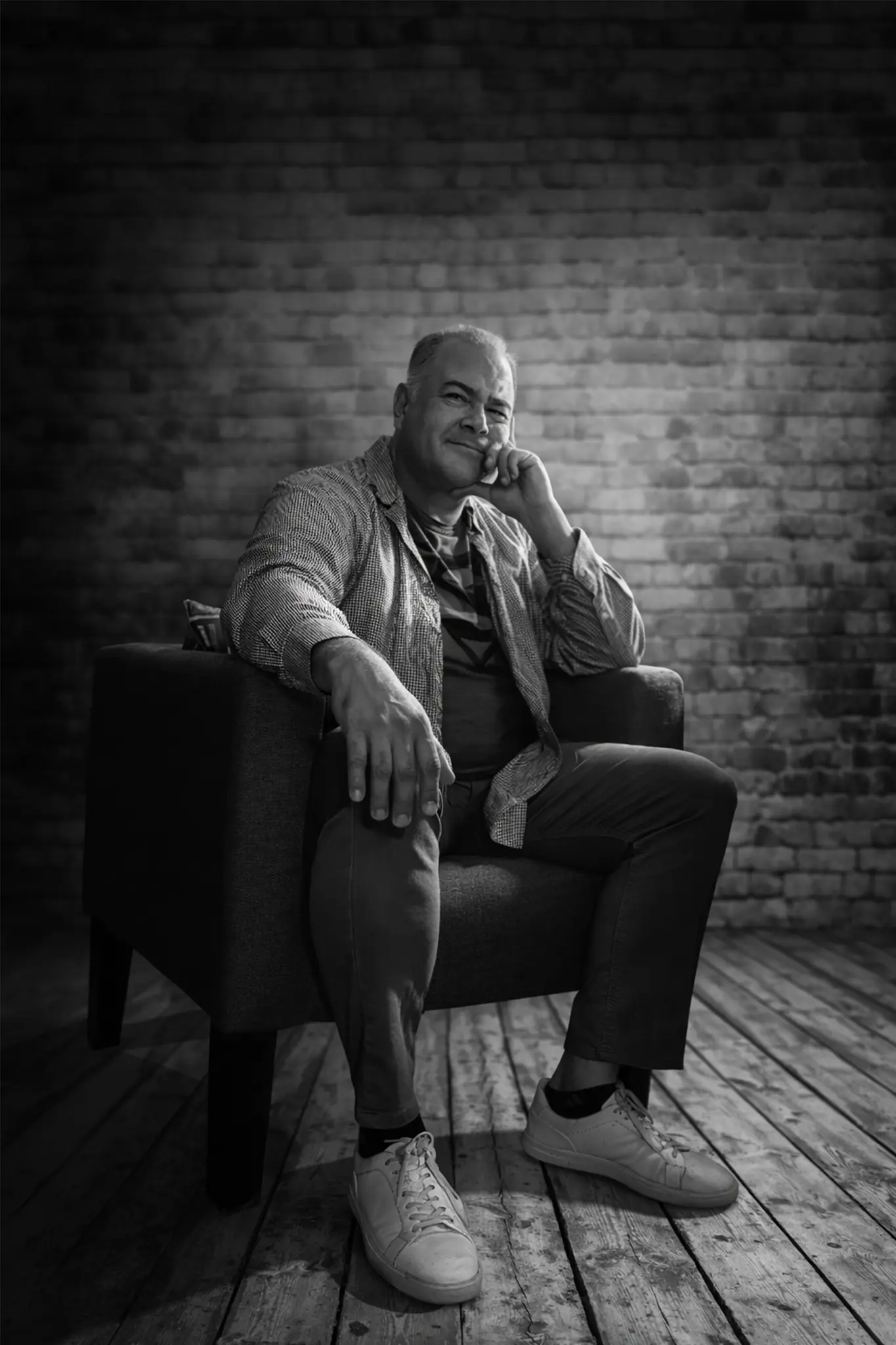 Vic Guiza seated in his studio